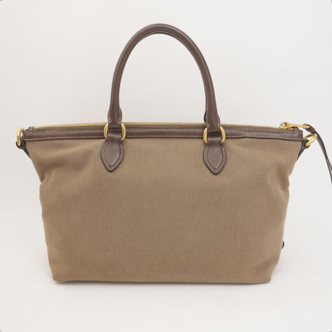 Prada Brown Jacquard Bow Two Way (Category: Luxury Bags & Wallets) located in Taguig. Submitted by dluxenest (Listing ID 1461630833, Image 3). Description: Last price posted Inclusion: strap, identification card, guarantee card, clochette You may follow us on IG : dluxenest FB : Dragons Luxe Nest.
