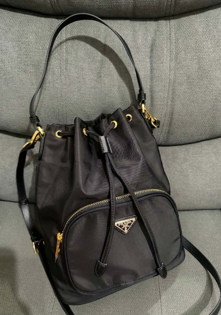 Prada Large Nylon Bucket (Category: Shoulder Bags) located in Quezon City. Submitted by luxxechic (Listing ID 1461699367, Image 1). Description: coded with tag made in Italy lampo under zip with sling with dust bag good as new no issue actual photo posted japan preloved mop: gcash .