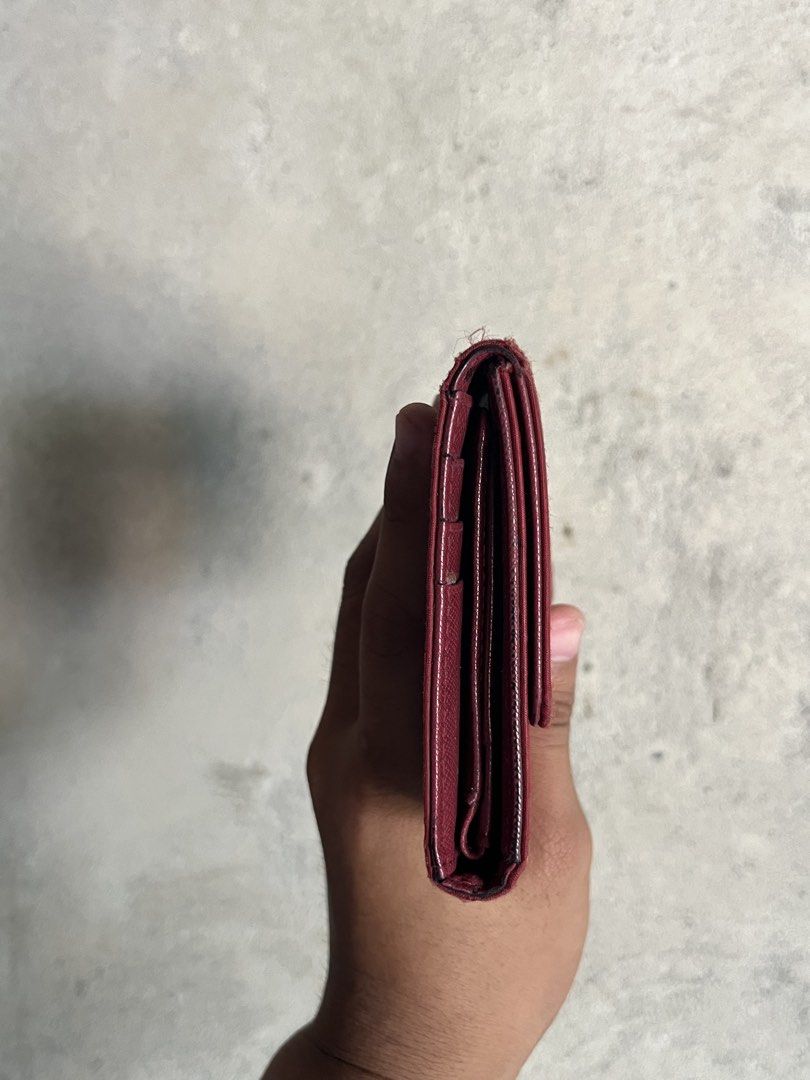 Prada Maroon Wallet (Category: Wallets & Card holders) located in Adams. Submitted by princess.maggie (Listing ID 1461691615, Image 2). Description: - good condition - ukay source - check pics for issue.
