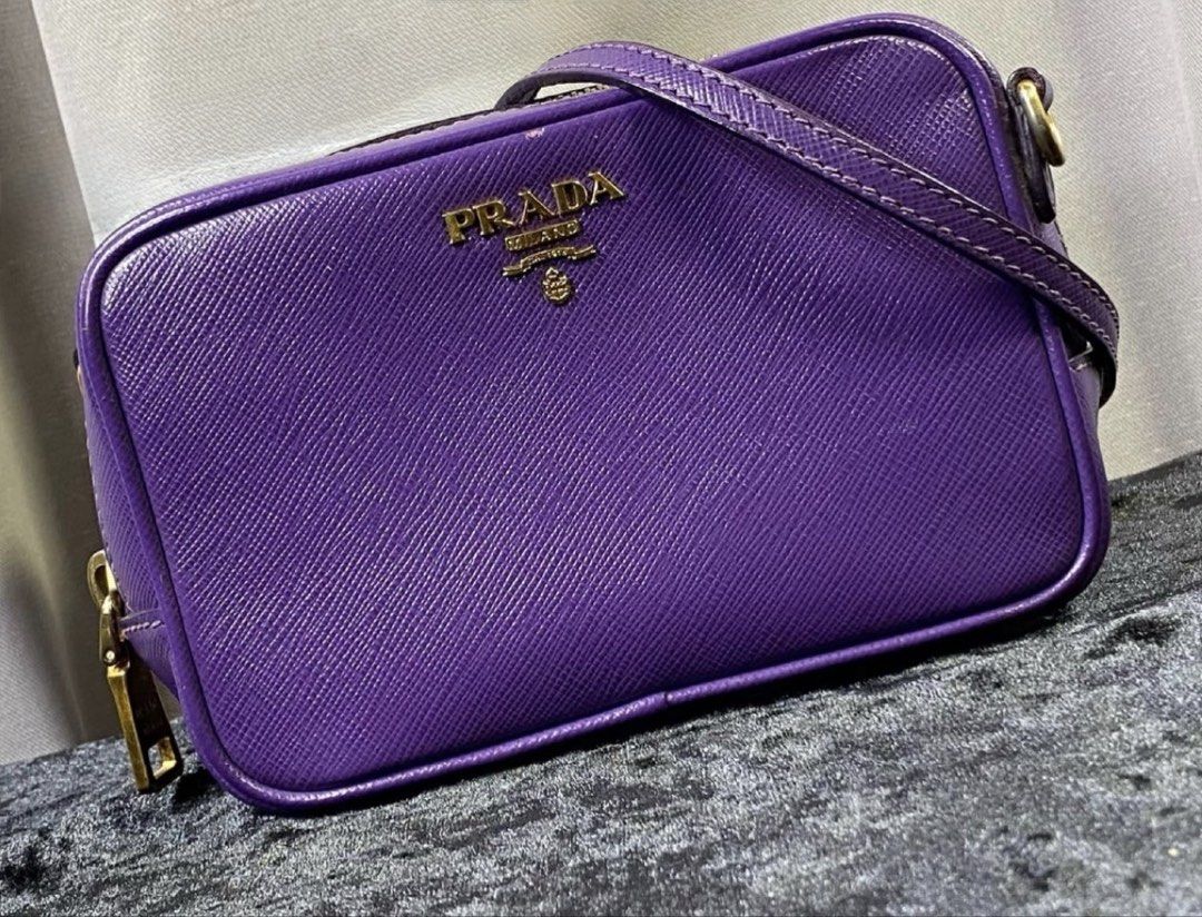 Prada Saffiano Leather Camera Bag Purple (Category: Luxury Bags & Wallets) located in Manila. Submitted by yanyancm (Listing ID 1461562441, Image 1). Description: - Authentic Prada Camera Bag - Purple Saffiano Leather - Gold Hardware - Adjustable Shoulder Strap - with provided dustbag - Normal signs of used - Negotiable.