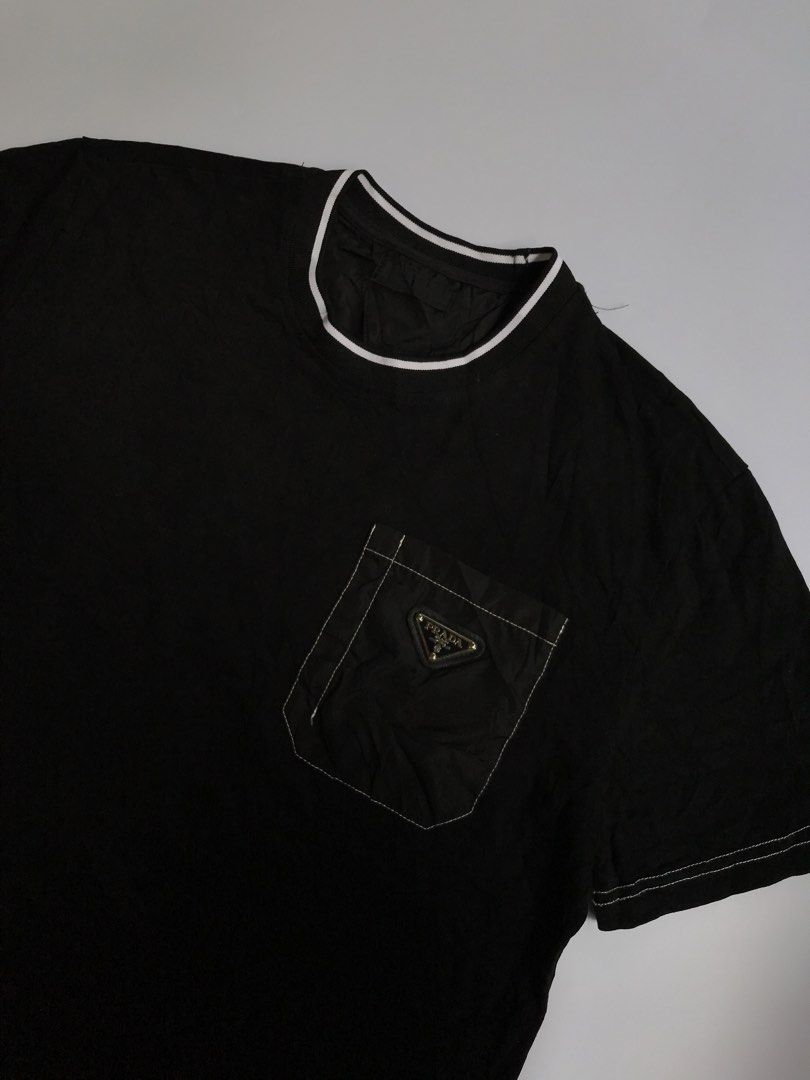 PRADA SHIRT (Category: Tshirts & Polo Shirts ) located in Aurora. Submitted by thrillthriftfinds123 (Listing ID 1461616052, Image 2). Description: PRADA SHIRT SIZE MEDIUM NO ISSUE GOOD CONDITION POCKET LOGO DESIGN 9.5 COLOR RATE .