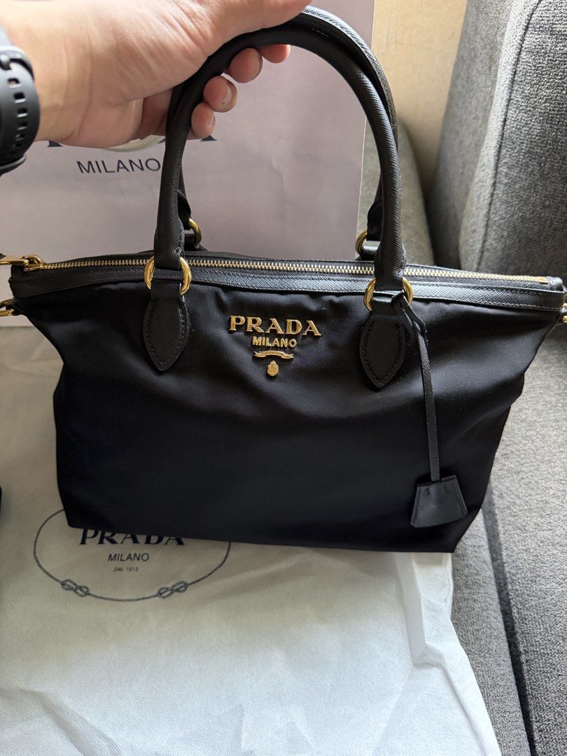 Prada Tessutto Nylon Bag (Category: Luxury Bags & Wallets) located in Paranaque City. Submitted by hjzs_closet (Listing ID 1461608220, Image 2). Description: Selling this Prada Nylon Tessuto Bag - Bought last December 2025 at Gotemba Premium Outlets, Japan - Inclusions: Dust bag, Receipt, Authenticity Card, Paper Bag - Its still on a brand new condition - Made out of nylon material and saffiano handle - Good for everyday usage suits for casual an