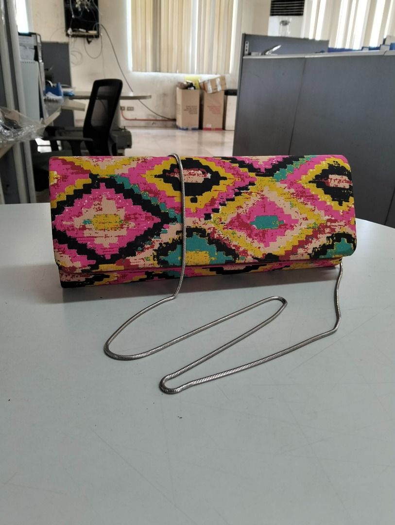 Preloved Colorful Geometric Pattern Clutch Bag with Silver Chain (Category: Clutches) located in Binan City. Submitted by croti_by_juliechi (Listing ID 1461576086, Image 2). Description: FOR SALE: Preloved Colorful Geometric Pattern Clutch Bag with Silver Chain Php300 PM for additional photo Location/Pick-up: BCPI (Best Chemicals & Plastics, Inc.) PTC, Brgy. Maduya, Carmona, Cavite Mon–Fri, 8AM–4PM (except sat-sun-holiday) https://share.google/0c