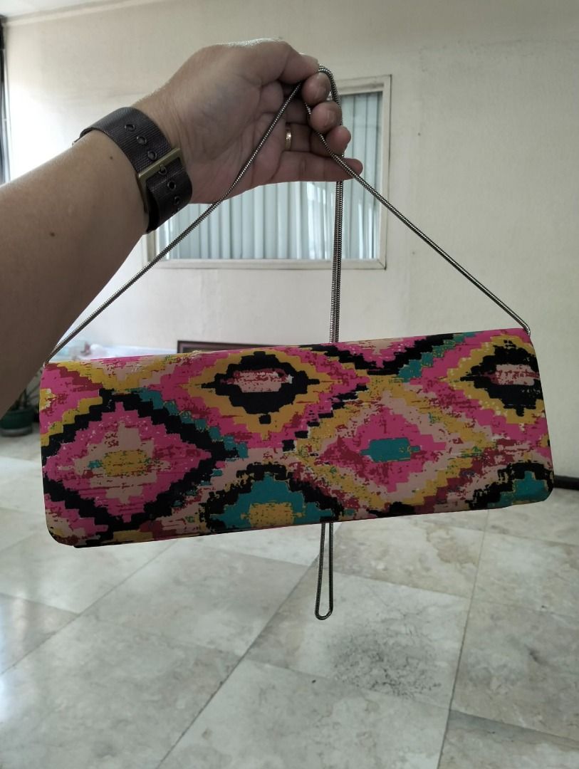Preloved Colorful Geometric Pattern Clutch Bag with Silver Chain (Category: Clutches) located in Binan City. Submitted by croti_by_juliechi (Listing ID 1461576086, Image 3). Description: FOR SALE: Preloved Colorful Geometric Pattern Clutch Bag with Silver Chain Php300 PM for additional photo Location/Pick-up: BCPI (Best Chemicals & Plastics, Inc.) PTC, Brgy. Maduya, Carmona, Cavite Mon–Fri, 8AM–4PM (except sat-sun-holiday) https://share.google/0c