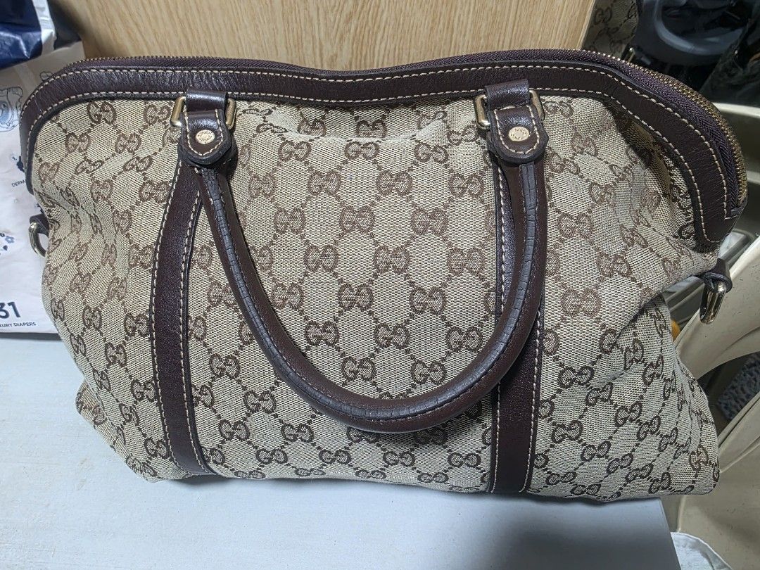 PRE-LOVED GUCCI GG MONOGRAM BAG (Category: Luxury Bags & Wallets) located in Manila. Submitted by yammm23 (Listing ID 1461642520, Image 2). Description: PRE-LOVED GUCCI GG MONOGRAM TOP-HANDLE BAG — BROWN ✨ DETAILS: 👍Classic GG monogram canvas exterior 👍Rich dark brown leather handles and trims 👍Double top handles for comfortable hand or arm carry 👍Full-length zipper closure 👍Gold-tone hardware 👍Spacious interior suitable for daily essential