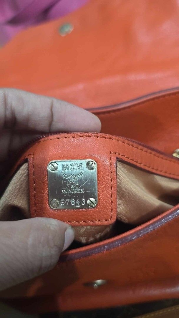 Preloved MCM Shoulder Bag Orange Leather Monogram (Category: Luxury Bags & Wallets) located in Quezon City. Submitted by mbpreloved65 (Listing ID 1461579161, Image 3). Description: - Authentic Orange MCM Shoulder Bag - Signature all-over monogram pattern - Genuine leather with gold hardware details - Features an interior zip pocket - Adjustable strap for comfortable wear - Selling Price: P1700 (Original Price: P2500).