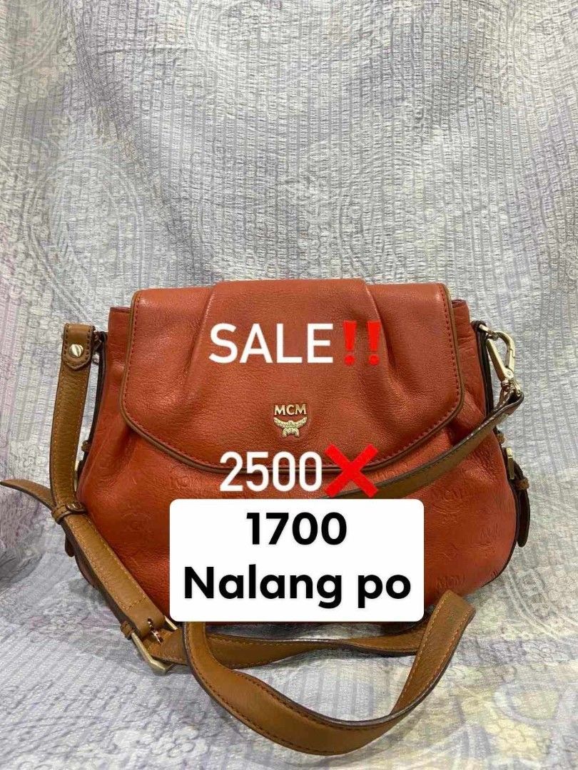 Preloved MCM Shoulder Bag Orange Leather Monogram (Category: Luxury Bags & Wallets) located in Quezon City. Submitted by mbpreloved65 (Listing ID 1461579161, Image 1). Description: - Authentic Orange MCM Shoulder Bag - Signature all-over monogram pattern - Genuine leather with gold hardware details - Features an interior zip pocket - Adjustable strap for comfortable wear - Selling Price: P1700 (Original Price: P2500).