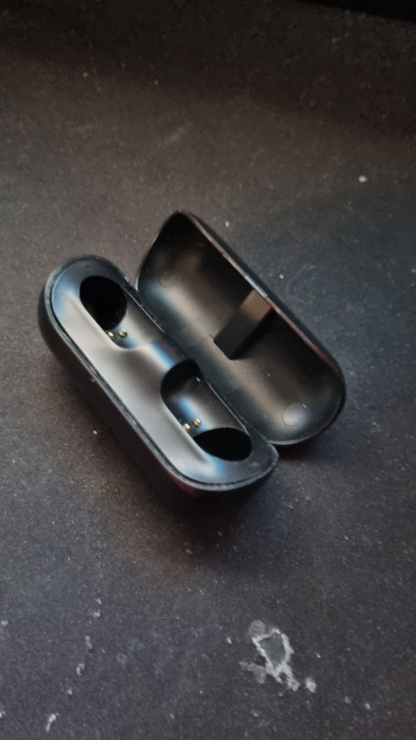 Proton True Wireless Earbuds Charging Case (Category: Earphones) located in Manila. Submitted by watchfanatic14 (Listing ID 1461727734, Image 2). Description: - Proton charging case for earbuds - Color: Black - Finish: Glossy - Condition: Shows minor scuffs from normal use - Function: Charges your earbuds, keeping them powered up.