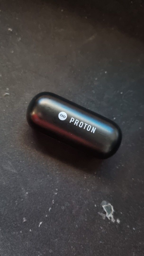 Proton True Wireless Earbuds Charging Case (Category: Earphones) located in Manila. Submitted by watchfanatic14 (Listing ID 1461727734, Image 1). Description: - Proton charging case for earbuds - Color: Black - Finish: Glossy - Condition: Shows minor scuffs from normal use - Function: Charges your earbuds, keeping them powered up.