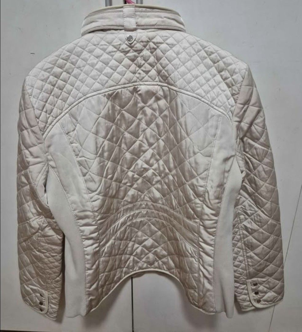Puffer Jacket Zara size XL (Category: Coats, Jackets and Outerwear) located in Manila. Submitted by sorayabarr50152 (Listing ID 1460801779, Image 2). Description: - Cream colored quilted jacket - Zip-up front with pockets - Stand-up collar with snap details - Versatile for layering - Pairs well with jeans or dressier outfits.