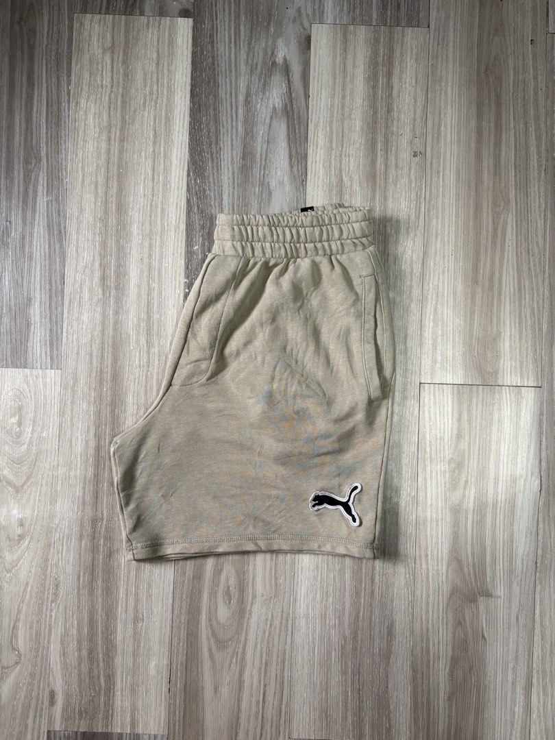 Puma Beige Sweat Shorts Size M (Category: Shorts) located in Rizal. Submitted by thriftdrip.402 (Listing ID 1461703097, Image 1). Description: - Beige Puma Sweat Shorts - Size: Medium - Elastic waistband with adjustable drawstring - Classic embroidered Puma logo on left leg - Ideal for casual outings or lounging at home.