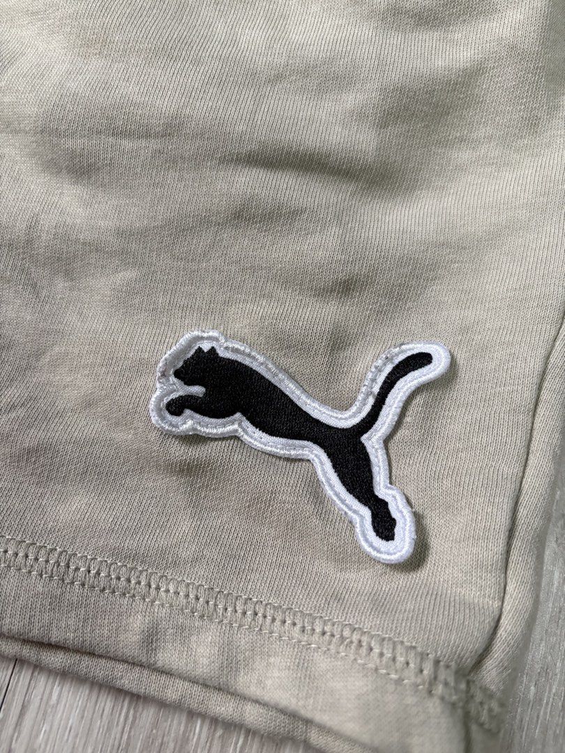 Puma Beige Sweat Shorts Size M (Category: Shorts) located in Rizal. Submitted by thriftdrip.402 (Listing ID 1461703097, Image 2). Description: - Beige Puma Sweat Shorts - Size: Medium - Elastic waistband with adjustable drawstring - Classic embroidered Puma logo on left leg - Ideal for casual outings or lounging at home.