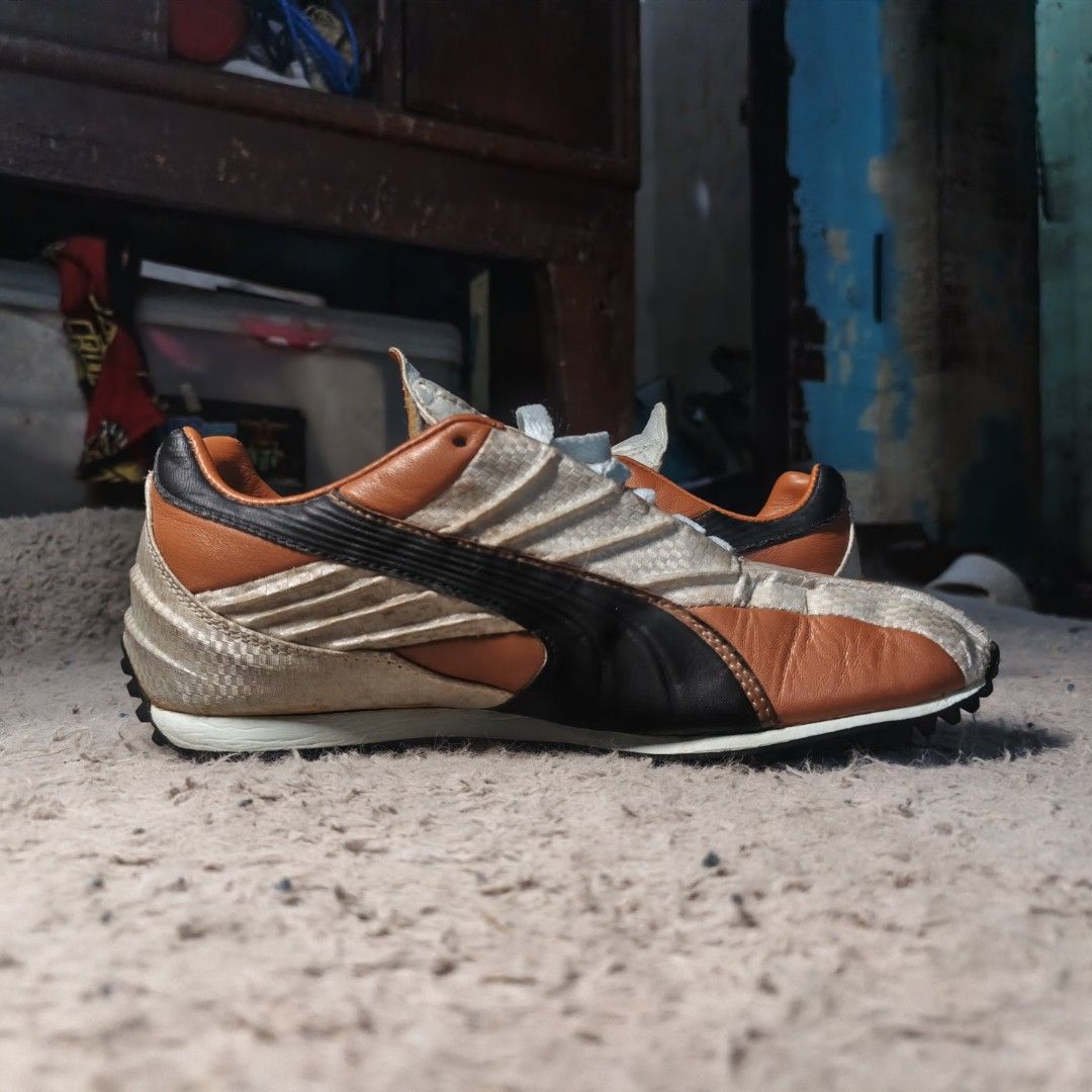 Puma speedcat beijing edition (Category: Sneakers) located in Baguio. Submitted by thrift_arcves (Listing ID 1461691571, Image 2). Description: - Puma sneakers in tan and orange colorway - Classic Puma stripe detail on the side - Light blue laces - White soles - Shows some signs of wear on soles and uppers - Ideal for casual wear or light activities - Please check photos for detailed condition.