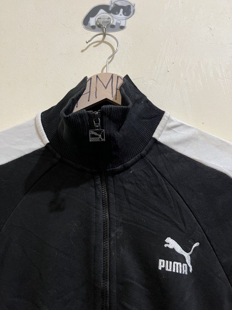 Puma Track Jacket Black White (Category: Coats, Jackets and Outerwear) located in Manila. Submitted by juspheroca82034 (Listing ID 1461686043, Image 3). Description: - Classic Puma track jacket - Color: Black with white sleeve stripes - Features: Full zip front, stand-up collar - Comfort: Ribbed cuffs and hem - Practical: Two side pockets - Versatile: Ideal for casual wear or sports.