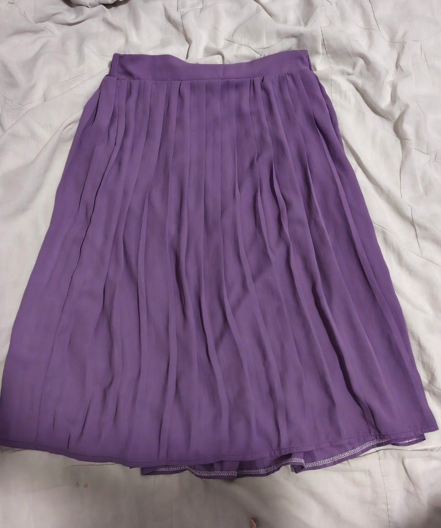 Purple Pleated Midi Skirt with Satin Lining (Category: Skirts) located in Antipolo. Submitted by _suspiria (Listing ID 1461673049, Image 1). Description: - Purple pleated midi skirt - Waist: 25in but Garterized to 28in - Length: 24in - Garterized waist - Satin lining.
