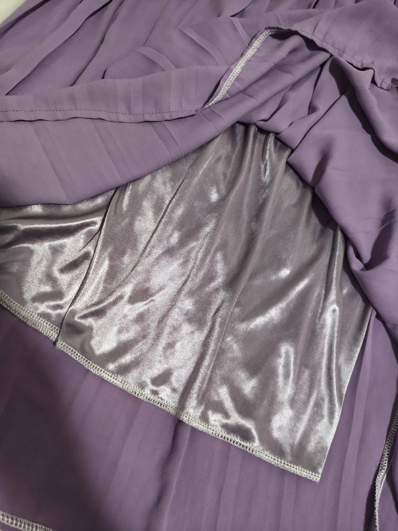 Purple Pleated Midi Skirt with Satin Lining (Category: Skirts) located in Antipolo. Submitted by _suspiria (Listing ID 1461673049, Image 2). Description: - Purple pleated midi skirt - Waist: 25in but Garterized to 28in - Length: 24in - Garterized waist - Satin lining.