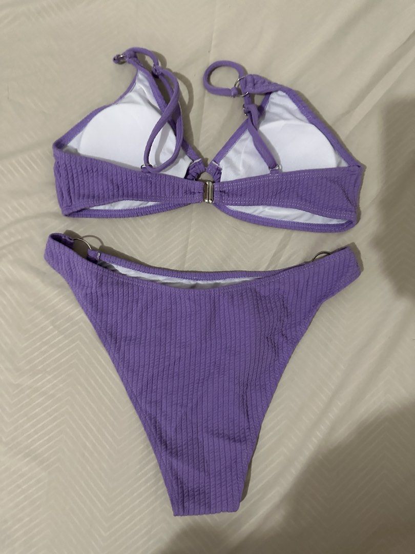 Purple Textured Bikini Set with Ring Details (Category: Bikinis & Swimsuits) located in Lipa City. Submitted by chiechums (Listing ID 1461569139, Image 2). Description: - Adorable purple bikini set - Textured fabric for a unique look - Stylish ring details on top and bottoms - Adjustable straps for a perfect fit - Secure clasp closure at the back - Ideal for your next beach or pool adventure.