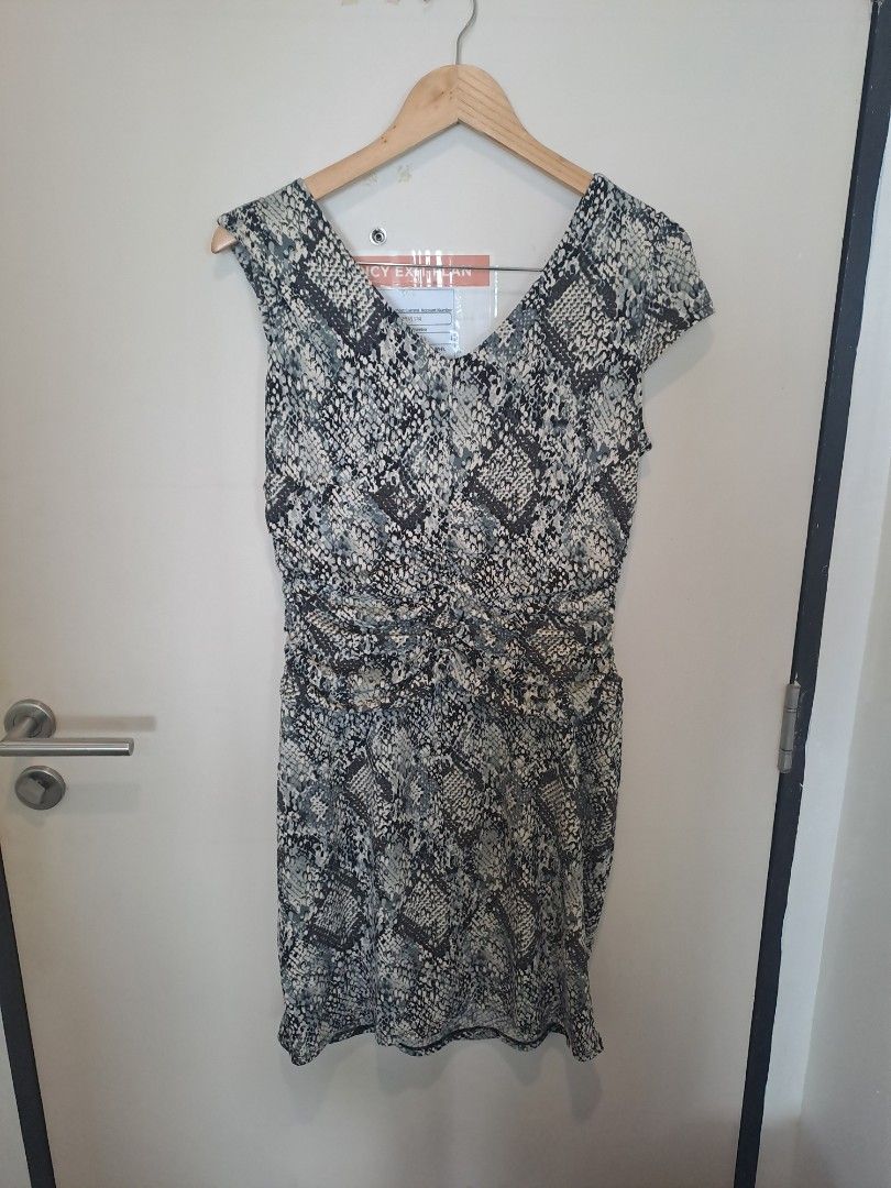 Python dress by cleo petite (Category: Dresses) located in Manila. Submitted by joanbalde39643 (Listing ID 1461587858, Image 3). Description: The image shows a grey and black snakeskin python print faux wrap dress from the brand Cleo Petites. It features a V-neckline, cap sleeves, a gathered draped front, and side ruching..
