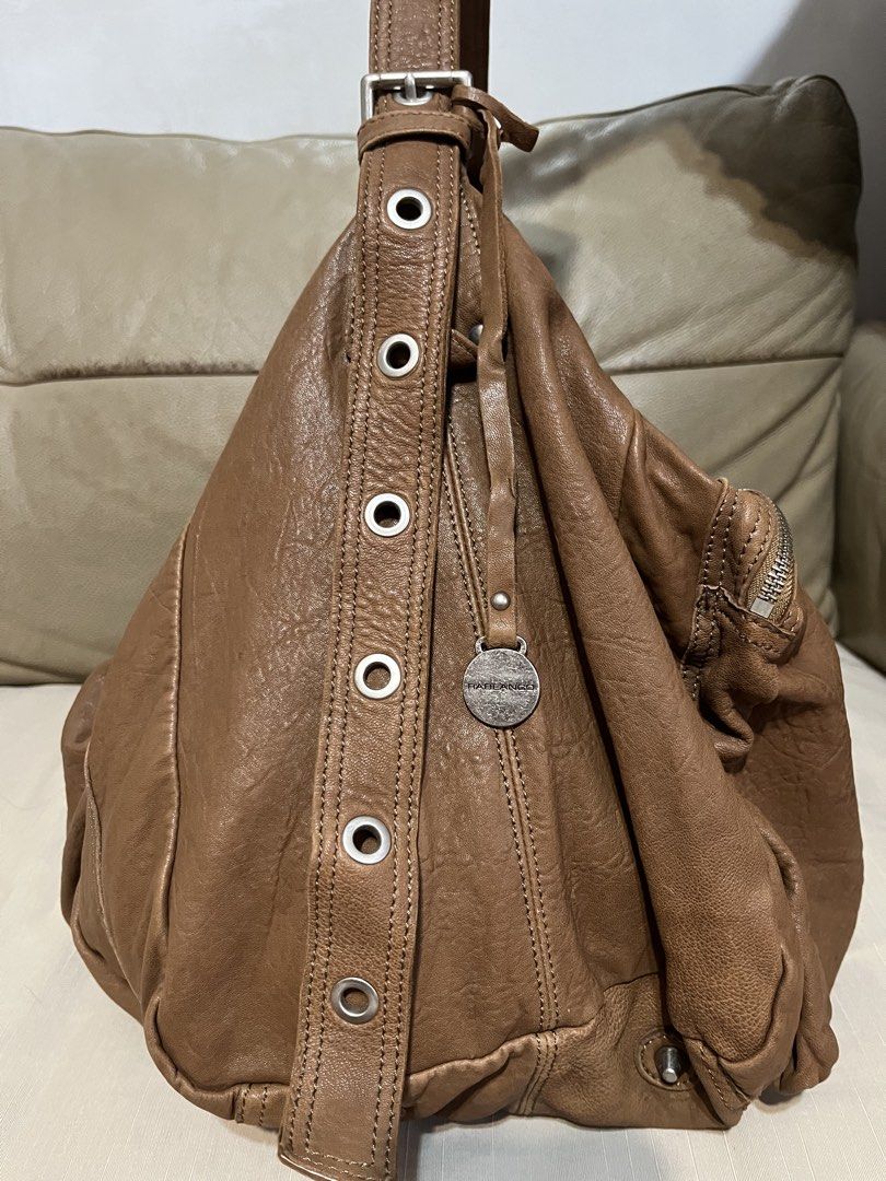 Rabeanco Leather Shoulder /Travel Bag (Category: Shoulder Bags) located in Calamba. Submitted by jupreloved_ (Listing ID 1461586570, Image 3). Description: Rabeanco brown leather shoulder bag. Slouchy design. Multiple exterior zippers. Interior pockets. Adjustable strap. Great for daily use. Brand: Rabeanco Size: Large Shipping through J&T. Payment are strictly through GCASH only, no COD. Exact size and color may be different from the picture. Th