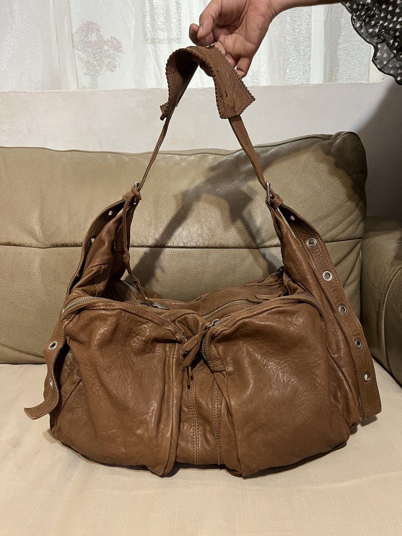 Rabeanco Leather Shoulder /Travel Bag (Category: Shoulder Bags) located in Calamba. Submitted by jupreloved_ (Listing ID 1461586570, Image 1). Description: Rabeanco brown leather shoulder bag. Slouchy design. Multiple exterior zippers. Interior pockets. Adjustable strap. Great for daily use. Brand: Rabeanco Size: Large Shipping through J&T. Payment are strictly through GCASH only, no COD. Exact size and color may be different from the picture. Th