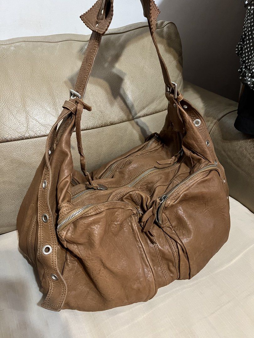 Rabeanco Leather Shoulder /Travel Bag (Category: Shoulder Bags) located in Calamba. Submitted by jupreloved_ (Listing ID 1461586570, Image 2). Description: Rabeanco brown leather shoulder bag. Slouchy design. Multiple exterior zippers. Interior pockets. Adjustable strap. Great for daily use. Brand: Rabeanco Size: Large Shipping through J&T. Payment are strictly through GCASH only, no COD. Exact size and color may be different from the picture. Th