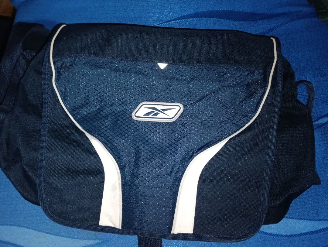 RAEBOK Navy Blue Messenger/ Shoulder/ Laptop Bag (Category: Sling Bags) located in Taguig. Submitted by iamyou_beepbop (Listing ID 1461664156, Image 1). Description: ❗ NEEDS WASHING ❗ - You can ask for additional pics or even a video to see the bags condition more clearly. Reason for selling: Decluttering and needing extra funds for academic needs. MOD 🚗: LALAMOVE (ONLY) extra tags: #school bag #computer bag #messenger bag #y2k bag #shoulder bag