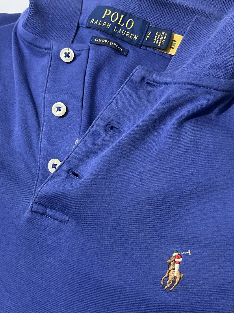 Ralph Lauren Polo Shirt (authentic) (Category: Tshirts & Polo Shirts ) located in Manila. Submitted by niconinii (Listing ID 1461793106, Image 2). Description: - Authentic blue Ralph Lauren Custom Slim Fit Cotton Polo Shirt with qr - Custom slim fit - multi color pony - Soft cotton material - 20x26 - has 1 small slit - Well-maintained - color rate 9.5/10 .