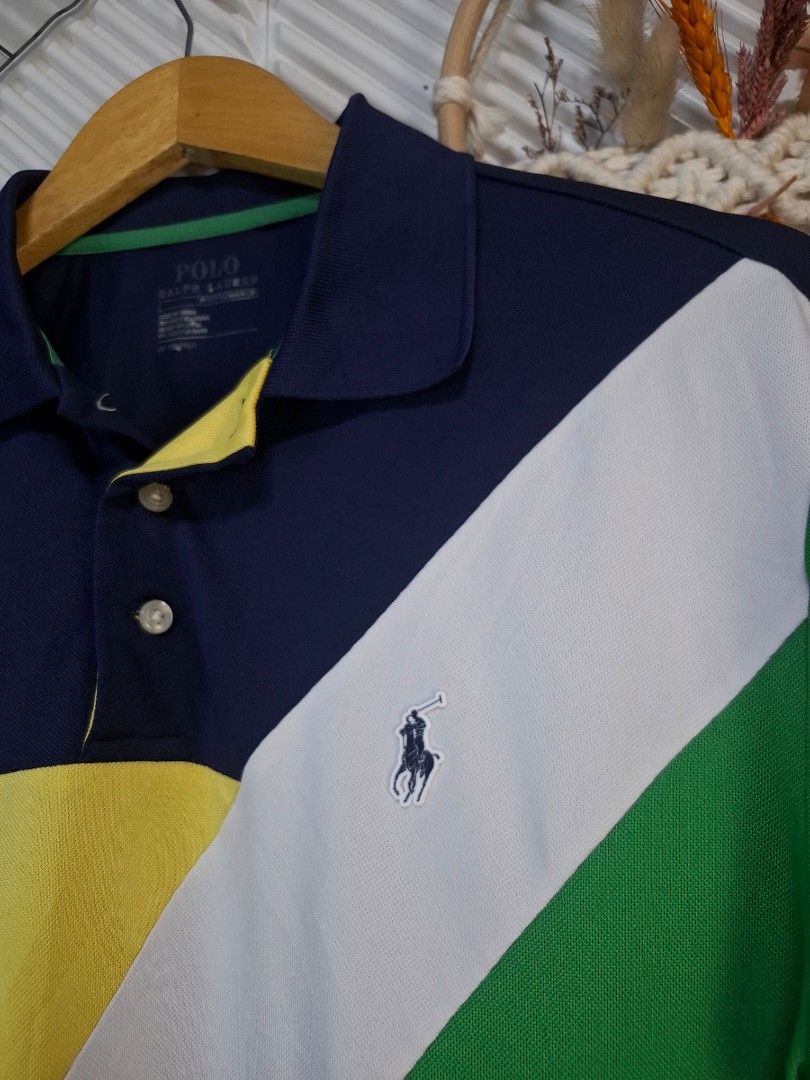 Ralph Lauren Polo Shirt (Category: Tshirts & Polo Shirts ) located in Bulacan. Submitted by cathycampo51092 (Listing ID 1461584871, Image 1). Description: Ralph Lauren polo shirt. Cool color block design with navy, white, green, and yellow. Fits M-L. Chest width is 22 inches, length is 26 inches. Great condition.