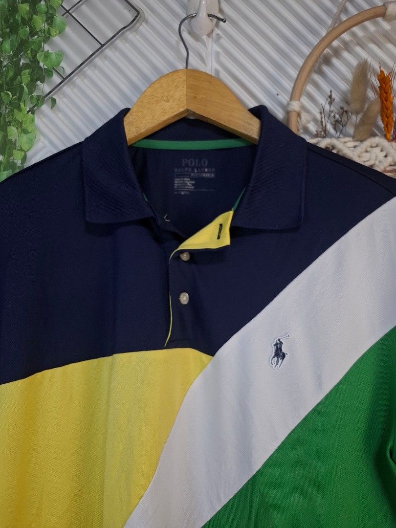 Ralph Lauren Polo Shirt (Category: Tshirts & Polo Shirts ) located in Bulacan. Submitted by cathycampo51092 (Listing ID 1461584871, Image 2). Description: Ralph Lauren polo shirt. Cool color block design with navy, white, green, and yellow. Fits M-L. Chest width is 22 inches, length is 26 inches. Great condition.