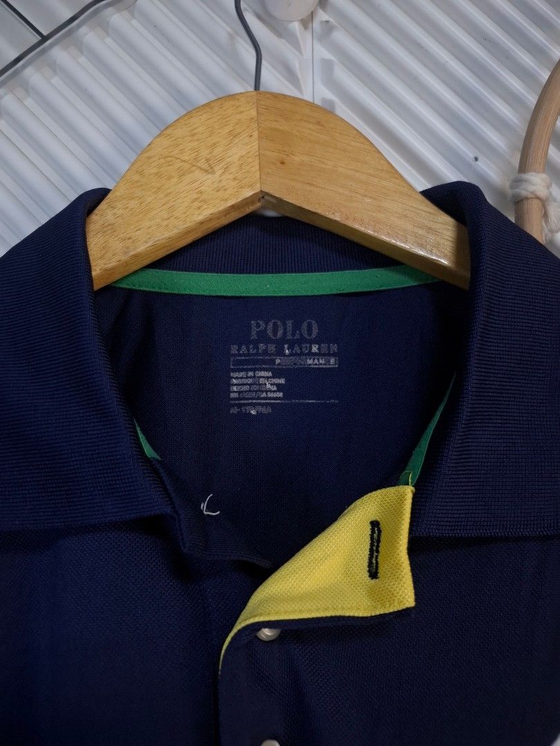 Ralph Lauren Polo Shirt (Category: Tshirts & Polo Shirts ) located in Bulacan. Submitted by cathycampo51092 (Listing ID 1461584871, Image 3). Description: Ralph Lauren polo shirt. Cool color block design with navy, white, green, and yellow. Fits M-L. Chest width is 22 inches, length is 26 inches. Great condition.