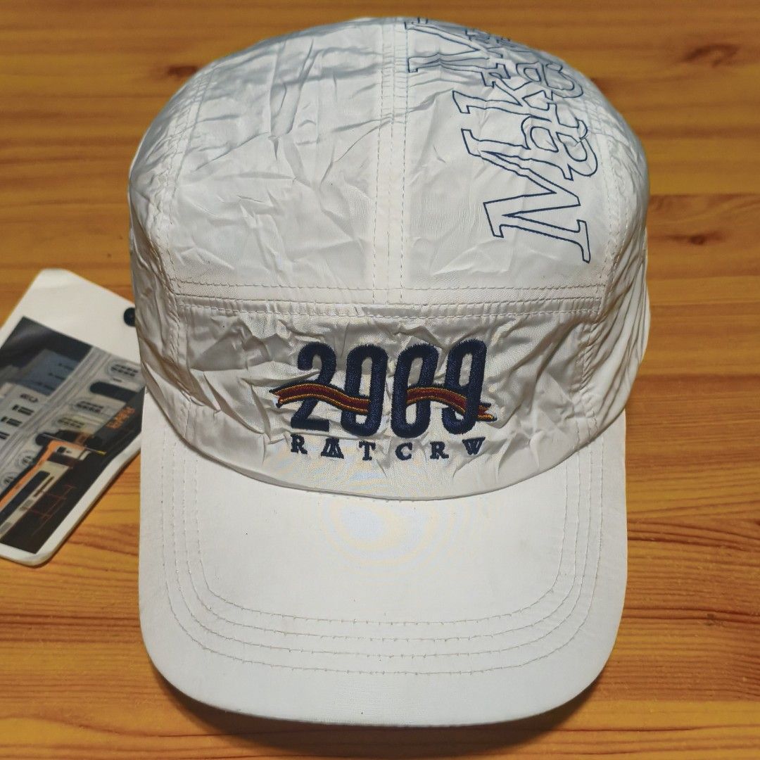 RATCRW 2009 White 5-Panel Cap "Make My Day" (Category: Caps & Hats) located in Manila. Submitted by caps08 (Listing ID 1461595664, Image 2). Description: - Brand: RATCRW - Color: White - Style: 5-Panel Cap - Front Embroidery: '2009' and 'RATCRW' - Top Embroidery: 'Make My Day' - Included: Postcard with train station and 'SINCE 2009' - Features: Adjustable strap at the back.