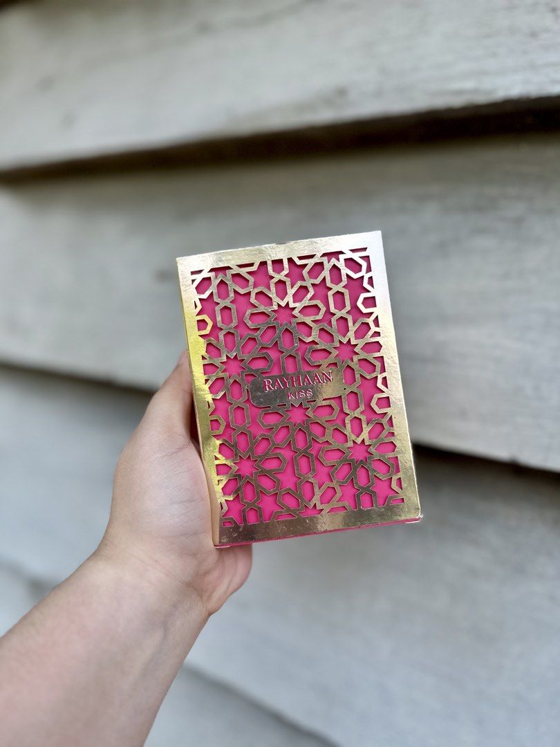 Rayhaan Kiss Eau de Parfum 100ml (Category: Fragrance & Deodorants) located in Navotas City. Submitted by japanpasabuybyjf (Listing ID 1461584362, Image 2). Description: - Rayhaan Kiss Eau de Parfum - Size: 100ml - Exquisite gold cage bottle design with vibrant pink liquid - Fragrance Notes: Oud, Coumarin, Rose - Origin: Made in UAE - Ideal for gifting or personal indulgence.