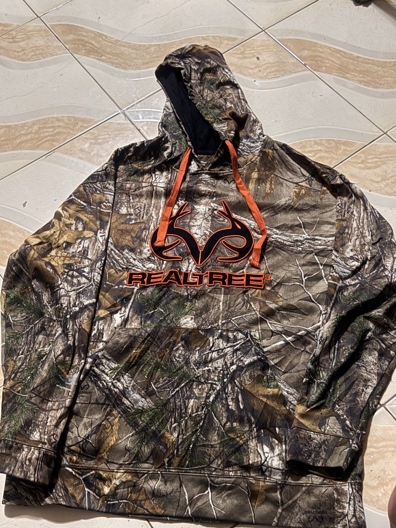 Realtree Camo Hoodie (Category: Coats, Jackets and Outerwear) located in Caloocan City. Submitted by thriftnimoi (Listing ID 1461726777, Image 2). Description: - Classic Realtree camouflage hoodie - Features iconic Realtree logo on the front - Comfortable and stylish for everyday wear - Ideal for outdoor enthusiasts and nature lovers - Adjustable drawstring hood for a personalized fit - Ribbed cuffs and hem ensure a snug and secure feel.