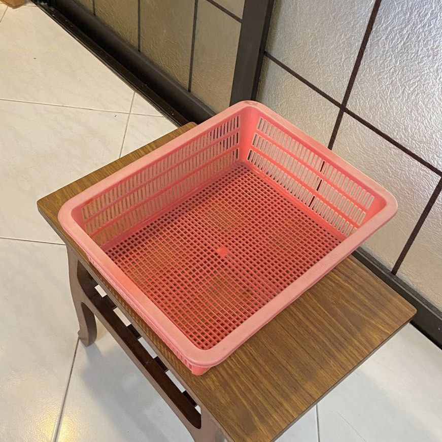 Rectangular Storage Basket Tray (Category: Storage Boxes & Baskets) located in Singapore. Submitted by ronghayley (Listing ID 1461621790, Image 2). Description: - Red plastic basket - Rectangular shape with grid pattern - Ventilation holes on sides - Ideal for organizing or drying items - Suitable for kitchen storage Measurements: Length 37cm Width 18cm Height 11cm Collect at Choa Chu Kang Check out my profile for more items.