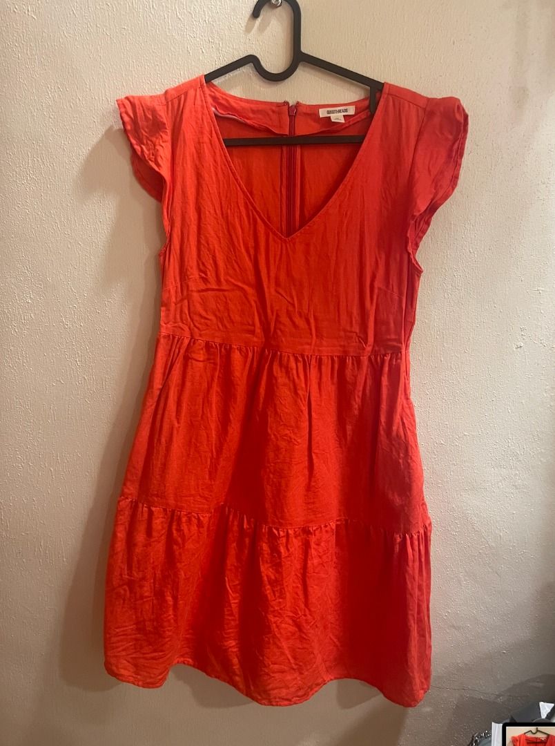 Red/Orange Tiered Mini Dress with Flutter Sleeves (Category: Dresses) located in Quezon City. Submitted by kiarampang60581 (Listing ID 1461731516, Image 3). Description: - Features charming flutter sleeves - Stylish tiered skirt design - Convenient back zipper closure - Light, breathable, and comfortable fabric - Size XS Feel free to message me for more details about the item! Loc: Culiat, Quezon City, Metro Manila MOP: GCash / BDO MOD: J&T / Gra