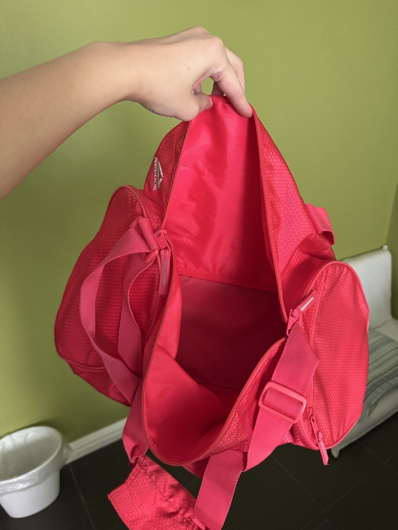 Reebok Gym Bag (Category: Shoulder Bags) located in Pasay City. Submitted by declutterwyza (Listing ID 1461571158, Image 3). Description: Reebok gym bag in pink. With one side pocket. No damages yet, I just don't use anymore..