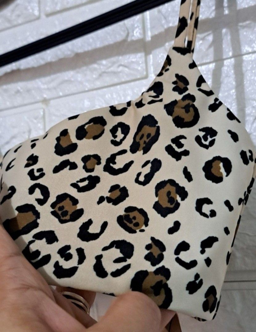 Reformation Malibu Bikini Top No Pads! (Category: Activewear) located in Taguig. Submitted by authprelovedonlineshop2 (Listing ID 1461696305, Image 3). Description: - Reformation Malibu Bikini Top - Size: XS - Print: Feline (leopard) - Features: Square neckline, thin straps - Color: Beige background with brown and black spots - No pads! - Condition: New with tags - Php1,488 🍀All items are preloved unless stated as brand new. 🍀Please manage your