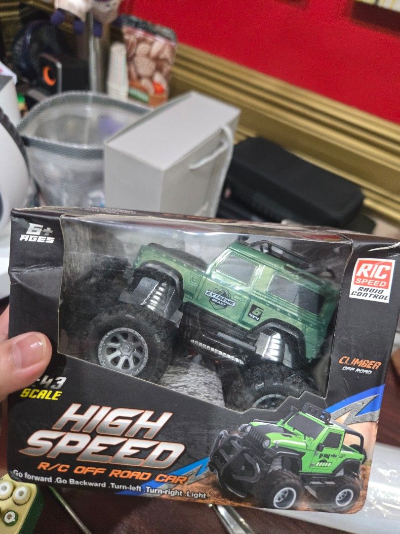 remote controlled car (Category: Remote Control Toys) located in Quezon City. Submitted by mello_letgoes (Listing ID 1461724925, Image 2). Description: High Speed R/C Off Road Car – 1:43 Scale | Green High Speed remote-controlled off-road car in green. • 1:43 scale • Off-road / 4x4 style design • Remote controlled • Forward and backward movement • Turn left and right • With light function • Green color • Comes with original box • Actual item show