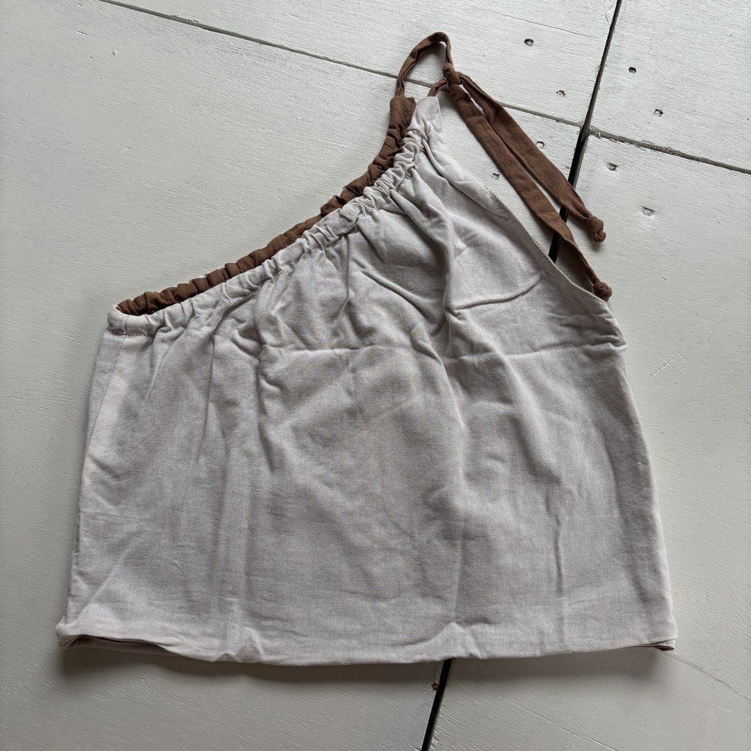 Riversible top (Category: Sleeveless) located in Pasig City. Submitted by katrina_angela_teng (Listing ID 1461576202, Image 2). Description: Brand new but washed Never worn Size xs-medium frame No issue .