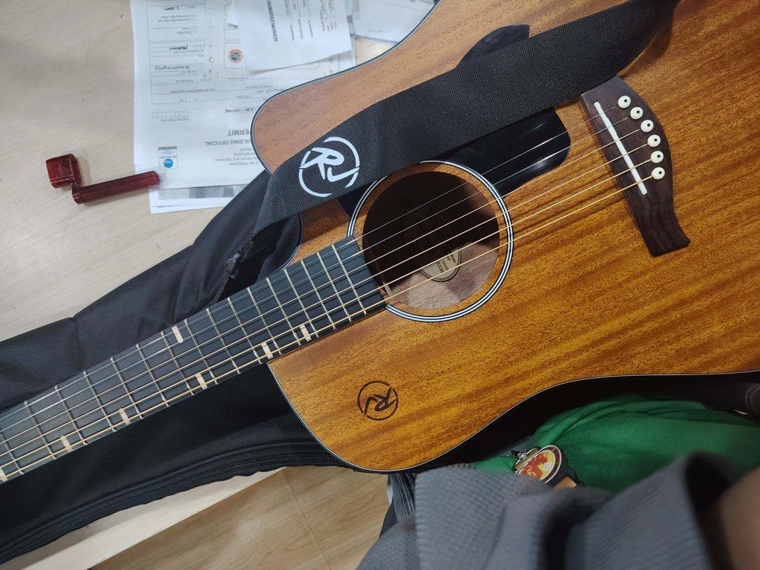 RJ Solid Series Mahogany Dreadnought Cutaway (Category: Musical Instruments) located in Mandaluyong City. Submitted by patriciajanee (Listing ID 1461752354, Image 2). Description: 🔥 LOOKING FOR A GREAT-SOUNDING GUITAR? THIS MIGHT BE THE ONE! 🎸 RJ Solid Series Mahogany Dreadnought Cutaway Selling my RJ Solid Series Mahogany Acoustic Guitar, used for only 6 months and still in like-new condition. No scratches, dings, or issues. Well-maintained an