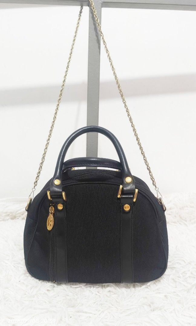 ROBERTA VIVIANI ITALY SHOULDER BAG (Category: Cross-body Bags) located in Kalibo. Submitted by secondchances.thriftsh8p (Listing ID 1460450253, Image 3). Description: - Authentic Roberta Viviani handbag from Italy - Elegant dome shape - Textured material with luxurious leather trim - Chic gold hardware details - Includes a detachable gold chain strap for versatile styling - Clean and well-maintained interior - Ideal for both daytime and evening o