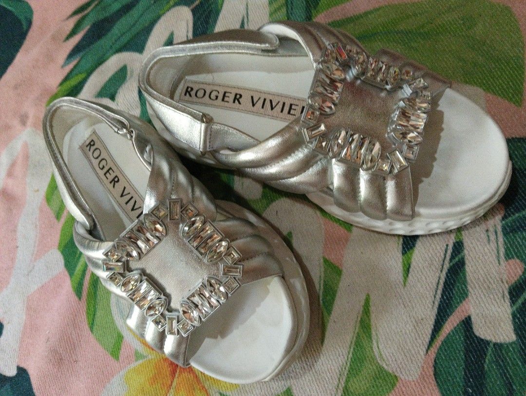 Roger Vivier Silver Crystal Buckle Slingback Sandals (Category: Flats & Sandals) located in Davao. Submitted by noelamihan05424 (Listing ID 1461570428, Image 3). Description: - Authentic Roger Vivier silver sandals - Iconic crystal buckle detail - Secure and comfortable slingback strap - Padded straps and sole for all-day comfort - Versatile: dress up or down - Comes with original box -23.5 cm on tape - No issue .