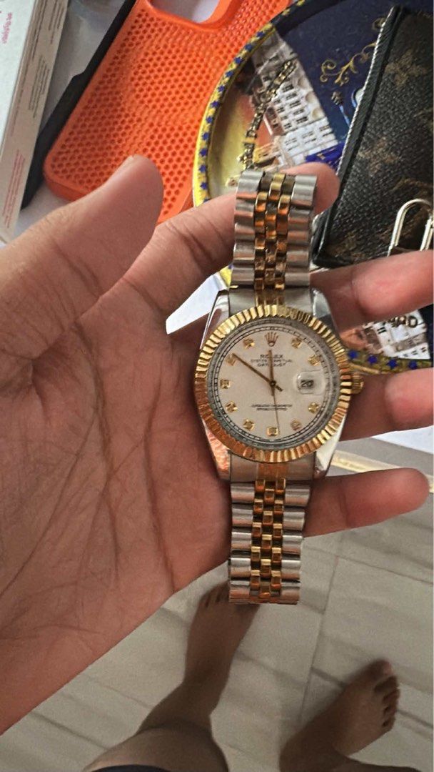ROLEX Datejust-style watch. (Category: Luxury Watches) located in Bacoor. Submitted by ricric0918 (Listing ID 1461606021, Image 2). Description: RUSH SALE FOR 5K BADLY NEED MONEY Two-Tone Datejust-Style Watch — For Sale Elegant Two-Tone Watch Classic silver & gold-tone design Fluted-style bezel Champagne/gold-tone dial Date display with magnified lens Jubilee-style bracelet Dressy/classic look, suitable for everyday wear or occasions Pre-owned co
