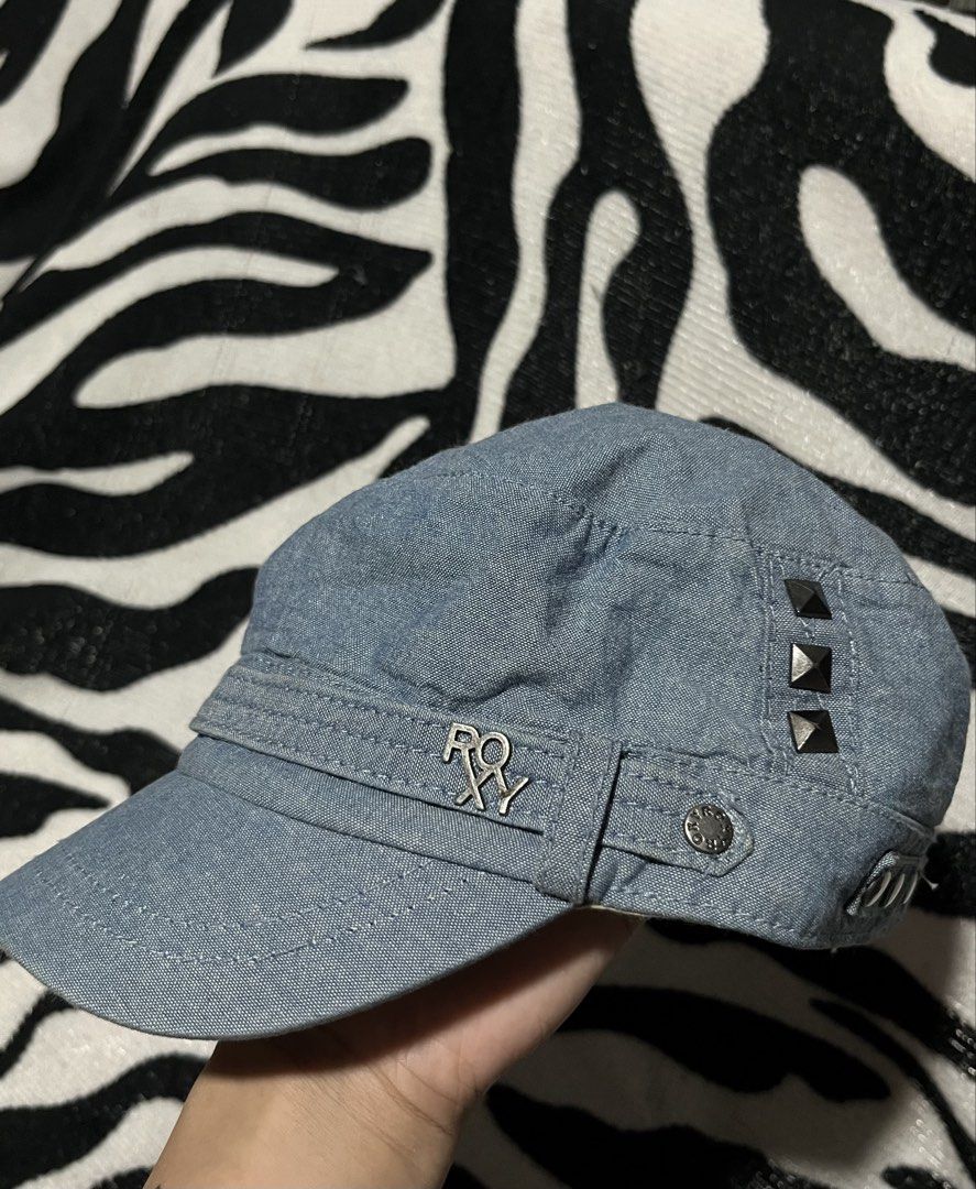 Roxy Denim Cap with Studs (Category: Hats & Beanies) located in Manila. Submitted by y2kcloset_ (Listing ID 1461664372, Image 3). Description: - Roxy denim cap - Features cool metal studs on the side - Adjustable strap at the back with a metal buckle - Small repair patch on the back (adds character!) - Ideal for everyday casual wear.
