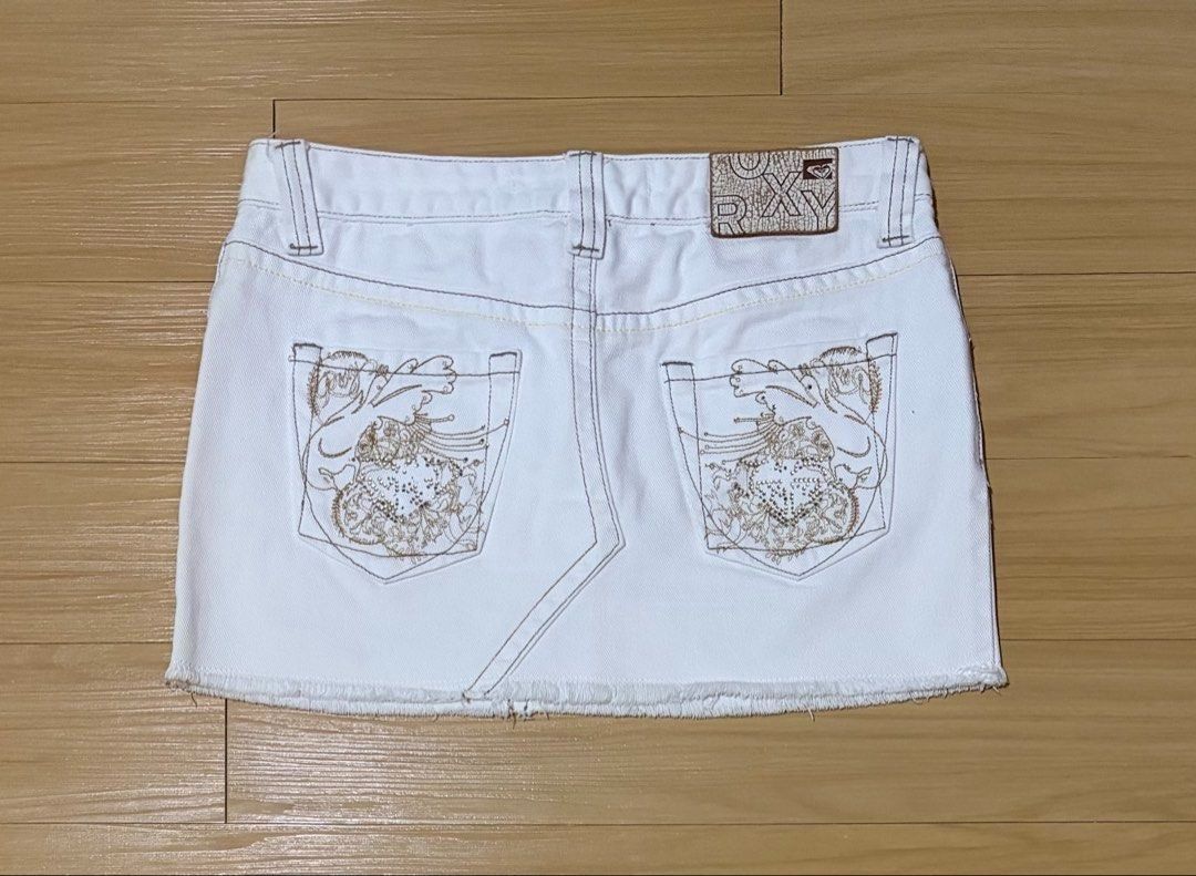 Roxy White Denim Mini Skirt Small (Category: Skirts) located in Quezon City. Submitted by garagesale2026 (Listing ID 1461795281, Image 2). Description: - Preloved - In good condition - Low-waist; Raw hem; Embroidered back pockets - Waist: 30"; Length: 11".