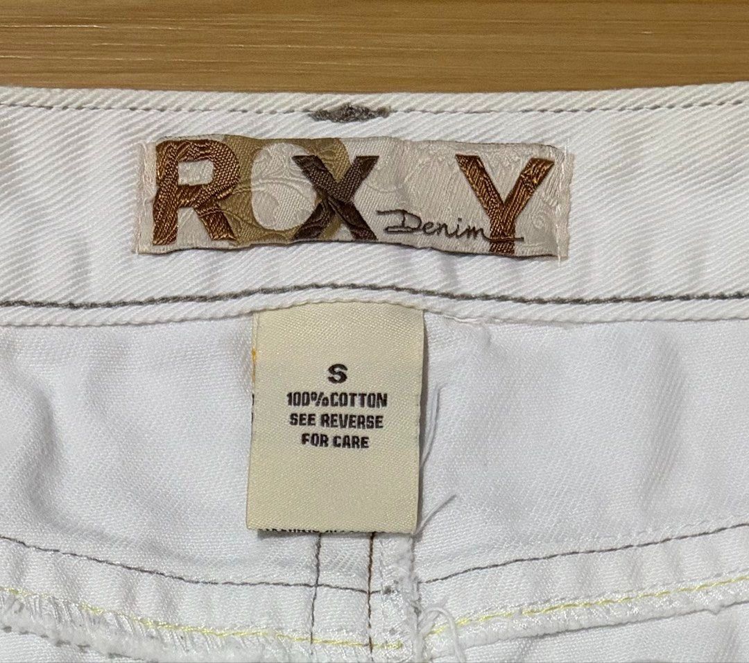 Roxy White Denim Mini Skirt Small (Category: Skirts) located in Quezon City. Submitted by garagesale2026 (Listing ID 1461795281, Image 3). Description: - Preloved - In good condition - Low-waist; Raw hem; Embroidered back pockets - Waist: 30"; Length: 11".
