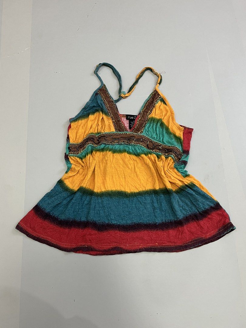 Rue 21 Tie Dye Tank Top Size S (Category: Sleeveless) located in Mabalacat. Submitted by aas_thriftfings (Listing ID 1461586408, Image 1). Description: - Cute Rue 21 tank top - Vibrant tie-dye pattern in yellow, green, red, and blue - Features delicate beaded trim detail - Adjustable straps for a perfect fit - Made from comfortable 100% rayon - Ideal for casual everyday wear.