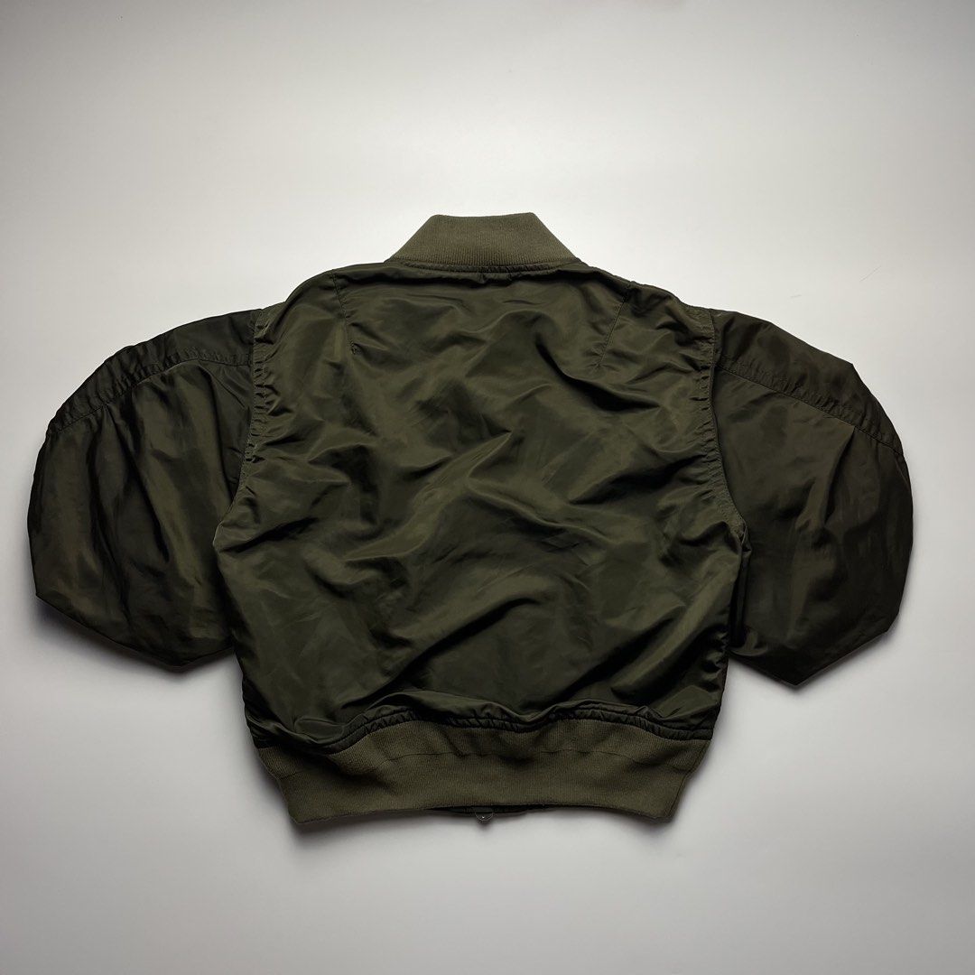 Sacai 22SS Nylon Twill Cropped Puff Bomber Jacket (Category: Luxury Apparel) located in Manila. Submitted by streetsavvy (Listing ID 1461679400, Image 2). Description: Sacai 22SS Nylon Twill Cropped Puff Bomber Jacket Size: 1 Width: 20” Length: 20” Shoulder: 17” Sleeve Length: 14” Hem: 15” Measured in Inches iconic piece from Sacai’s Spring/Summer 2022 collection. This piece features Chitose Abe’s signature hybrid design, combining classic MA-1 m