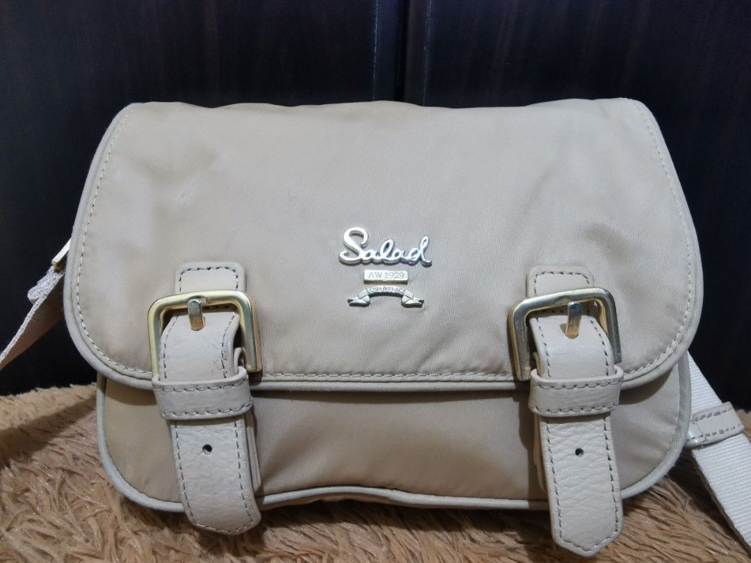 Salad Sling Bag (Category: Cross-body Bags) located in Aringay. Submitted by ycels_purselove (Listing ID 1461680011, Image 3). Description: Salad Sling Bag Nylon material Condition: preloved Flaws: needs cleaning (bawal sa maselan).
