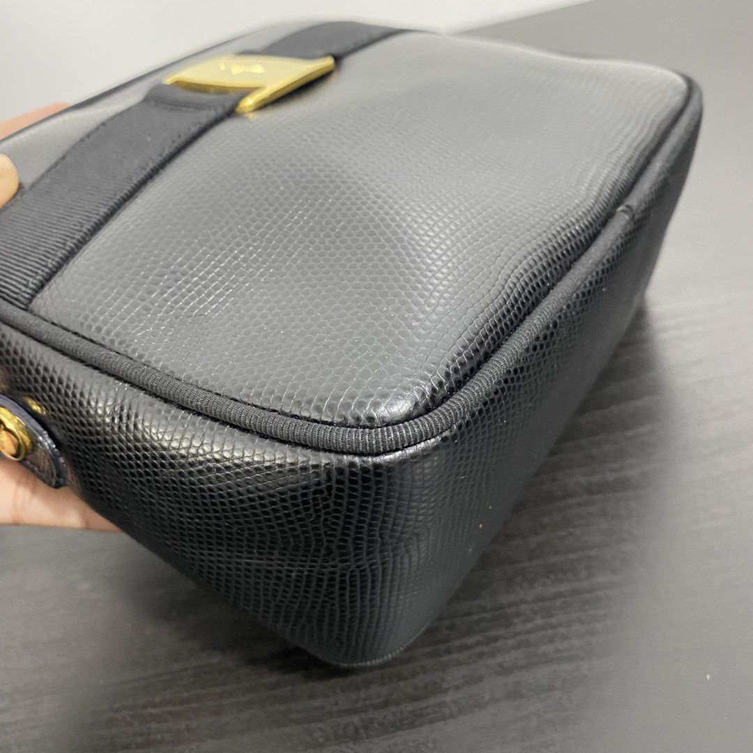 Salvatore Ferragamo Vara Sling Bag (Category: Cross-body Bags) located in Manila. Submitted by karlacotoc65578 (Listing ID 1461658270, Image 3). Description: - Brand: Salvatore Ferragamo - Model: Vara Sling Bag - Color: Black - Material: Embossed Lizard - Features: Iconic Vara bow with gold accent - Condition: Great.